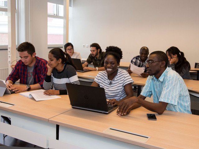 Studying in a classroom at IHE Delft,