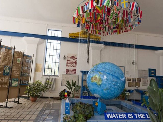 The rotating earth globe with all nations flags above, located in the main indoor section, SOMES Water Company copyright, 2012