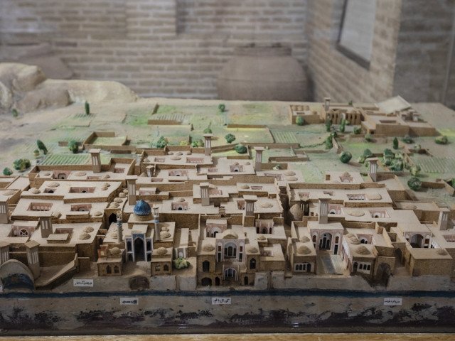 A maquette of a Qanat gallery irrigating the town (a gently sloping subterranean canal, which taps a water bearing zone at a higher elevation than the cultivated lands).