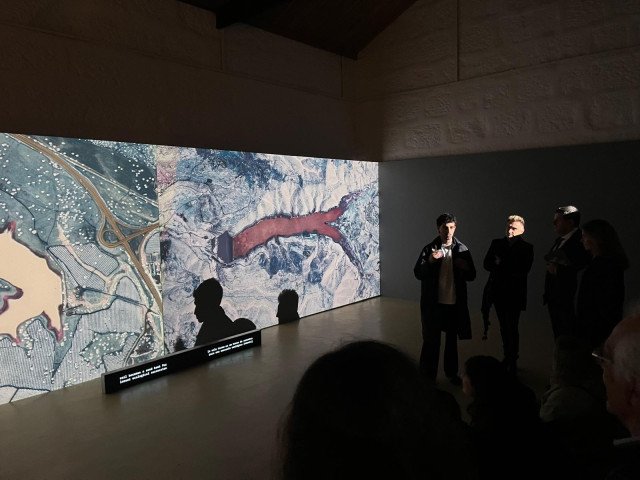 Miguel Teodoro in front of his video installation 'Peripheral Deserts'. Credits: Stefano Cagol
